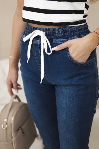 Dámské tmavé denim kalhoty se stahovacími lemy K-Fashion