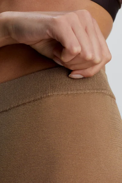 Beige dámské kalhoty Calvin Klein - Měkký úplet s průsvitným povrchem