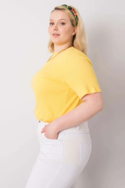 Žlutá pruhovaná dámská halenka Fashionhunters Plus Size