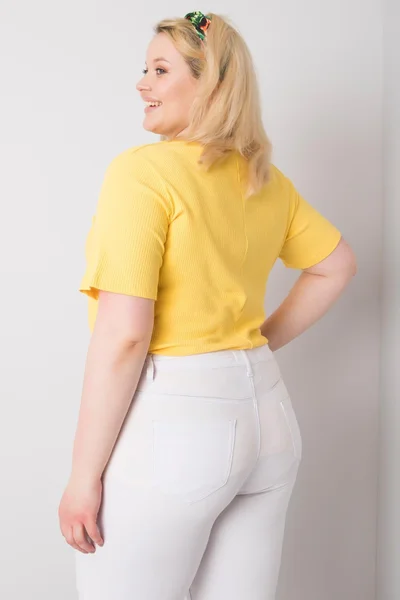 Žlutá pruhovaná dámská halenka Fashionhunters Plus Size