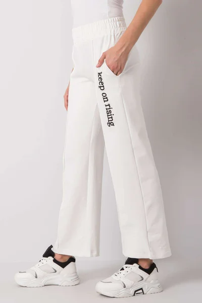 Dámské jednobarevné teplákové kalhoty v barvě ecru s nápisem FPrice