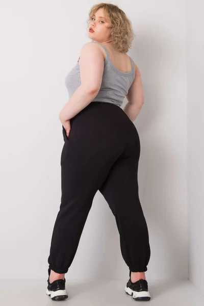 Černé dámské tepláky Plus Size FPrice