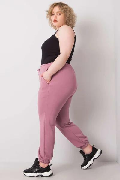 Pudrově růžové dámské tepláky Plus Size FPrice