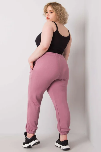 Pudrově růžové dámské tepláky Plus Size FPrice