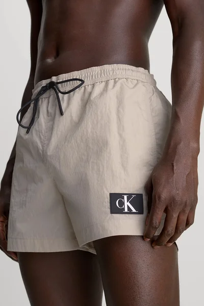 Plavky Calvin Klein Monogram béžové